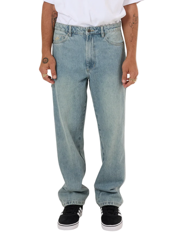 Light blue jeans worn by a person on a white background