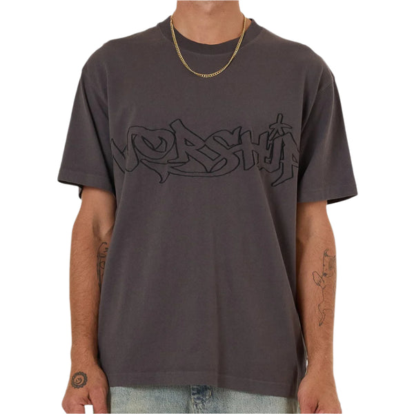Man wearing a dark gray t-shirt with a logo on a white background