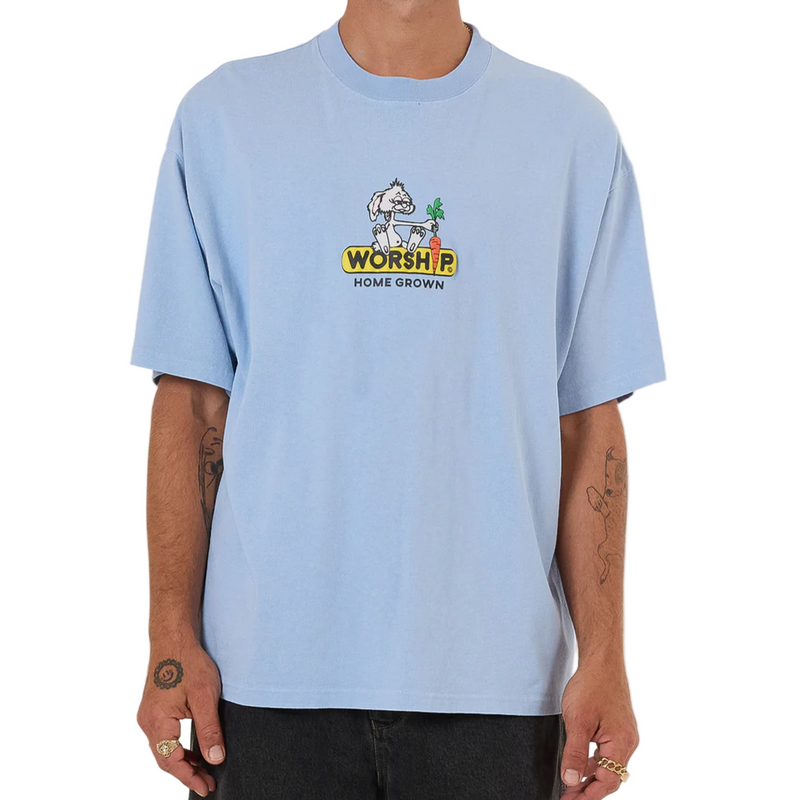 Person wearing a light blue t-shirt with a graphic design on a white background