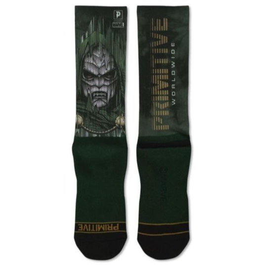 Green socks with a graphic design and 'Primitive' branding on a white background